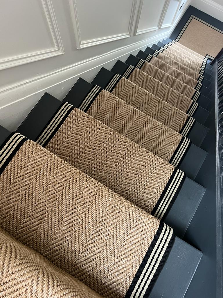 Bespoke stair runner made from Unnatural Flooring New England Woodstock with an Alternative thick black border, supplied and installed on stairs by Flooring 4 You Ltd